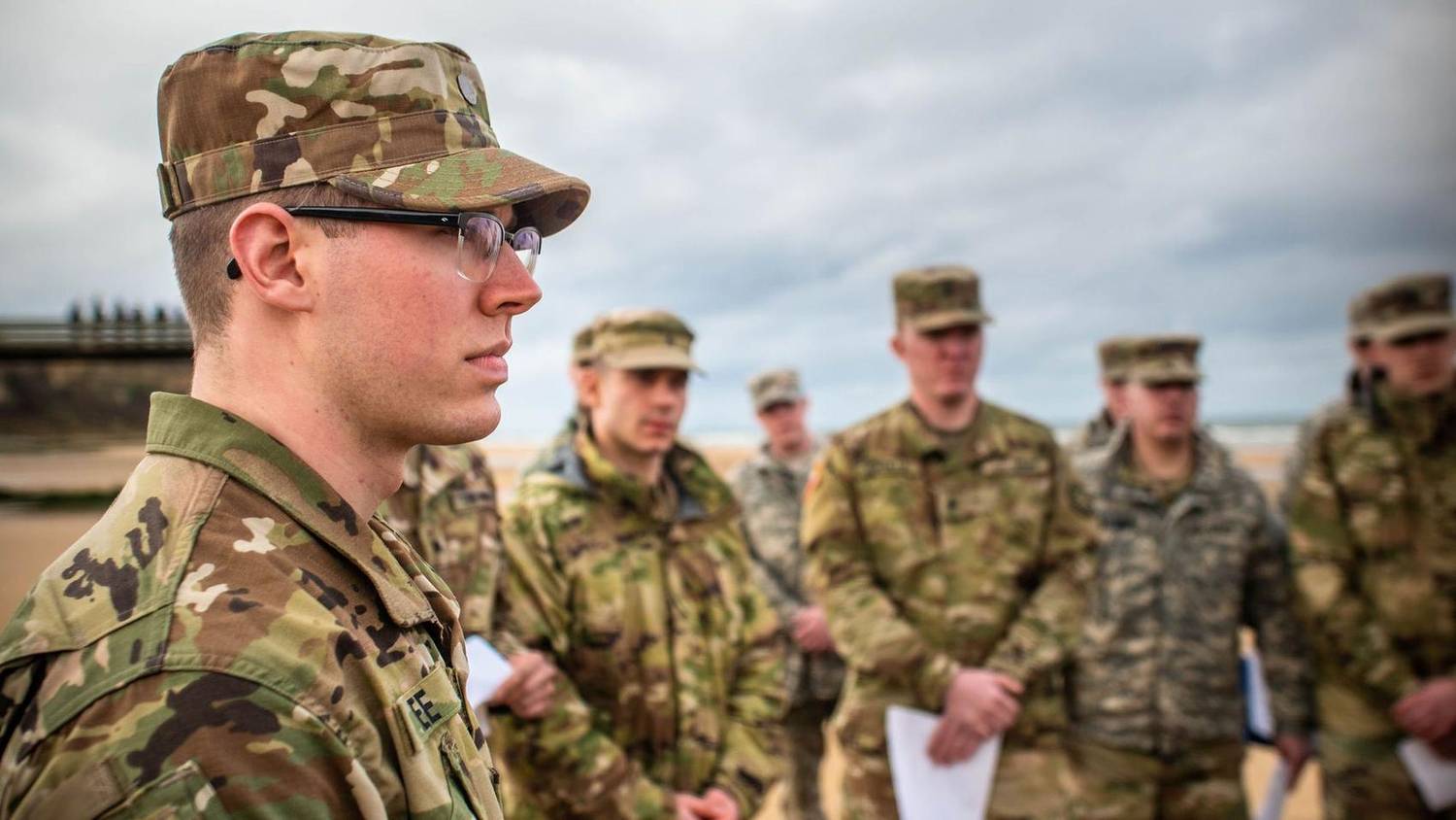 ROTC cadets briefed on a beach during training