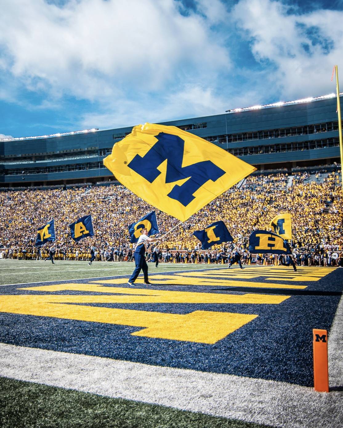 Flags waved on the field at a football stadium