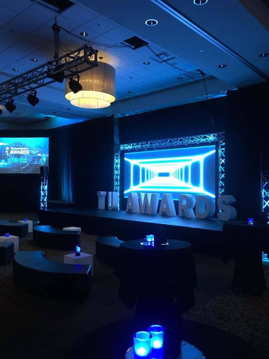 Empty awards show stage lit in blue before doors open
