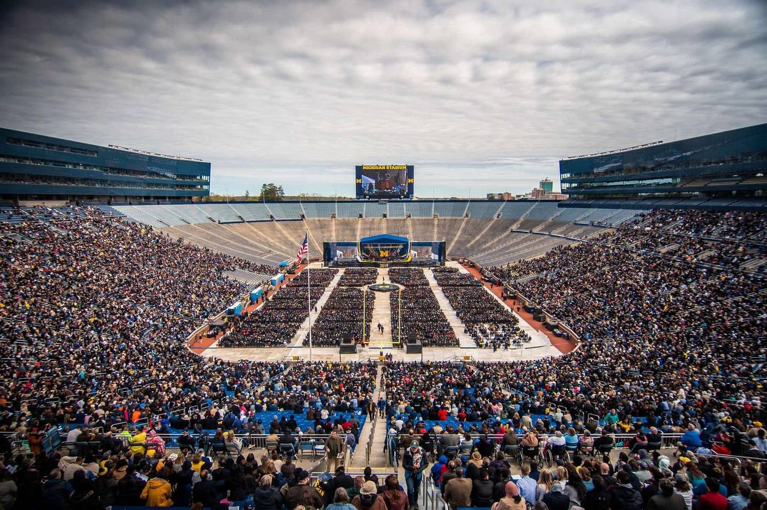 Aerial view of a packed stadium during a university commencement ceremony