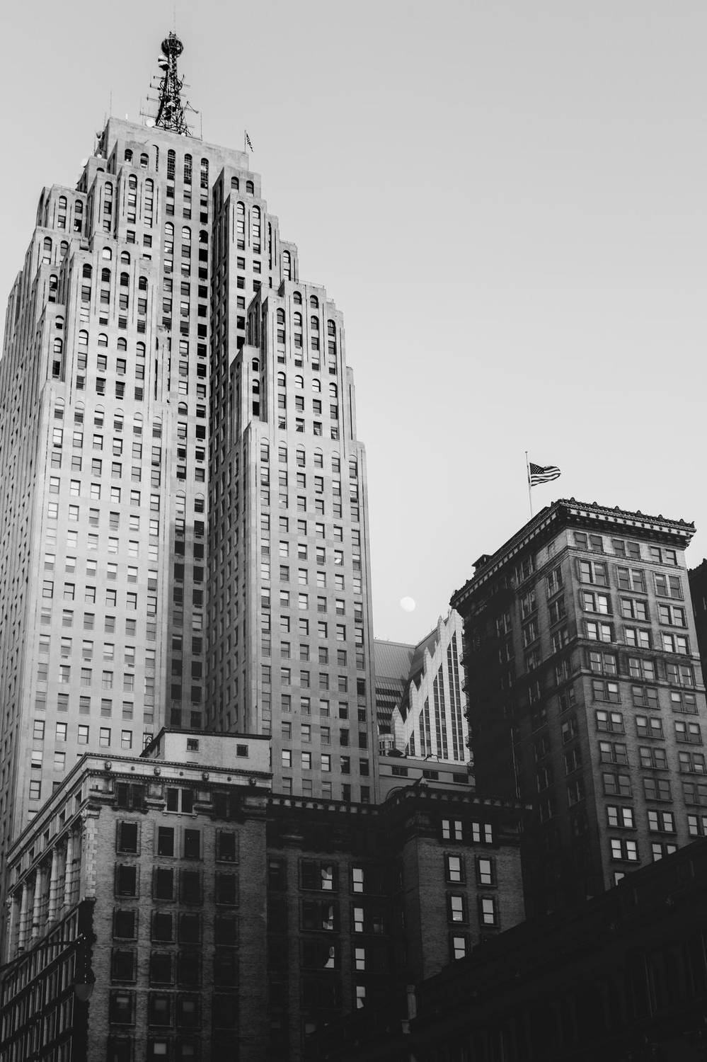 Black and white photo of Art Deco skyscrapers at dusk