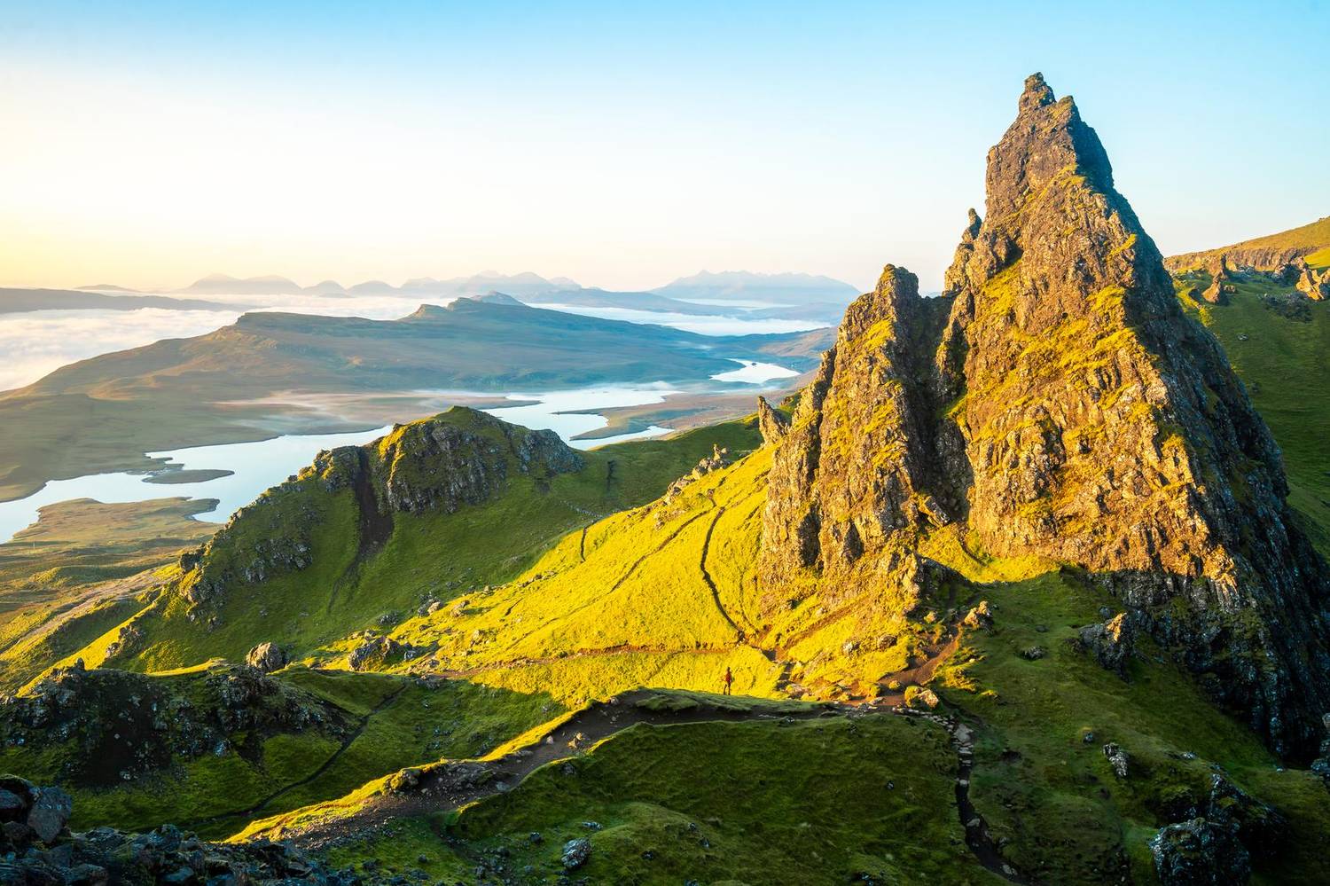 Rocky ridgeline overlooking lochs at sunrise